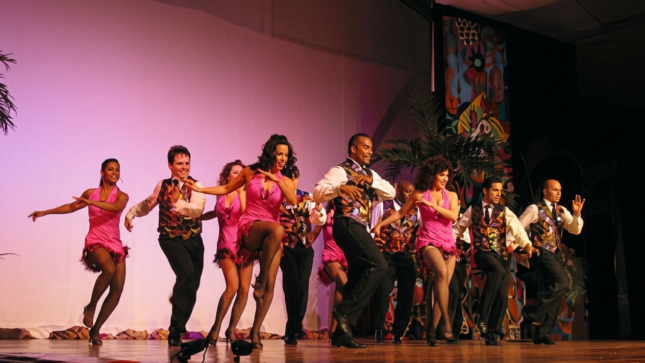 Salsa dancers performing on a large theatrical stage